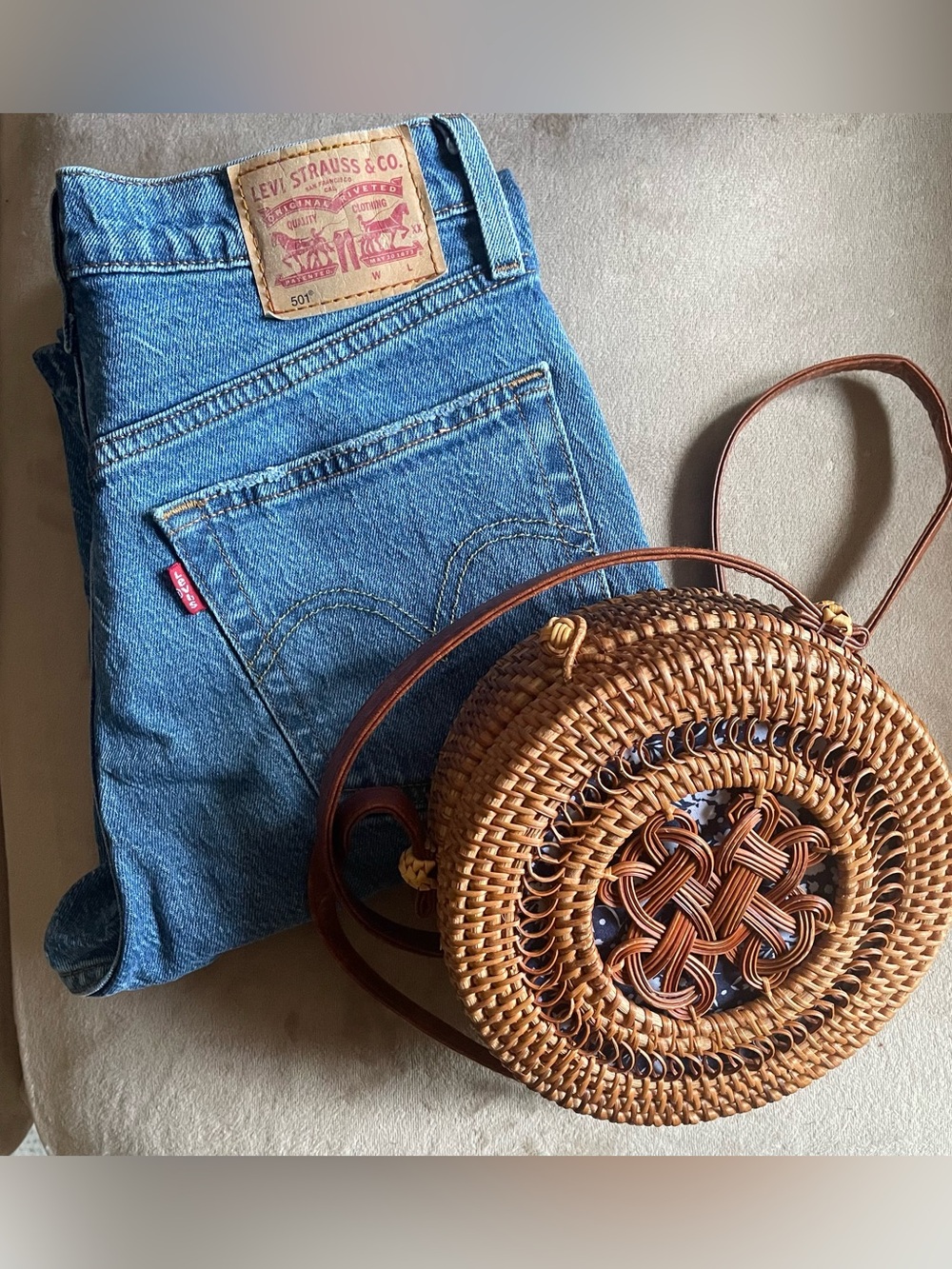 Levi's 501 jeans and woven purse
